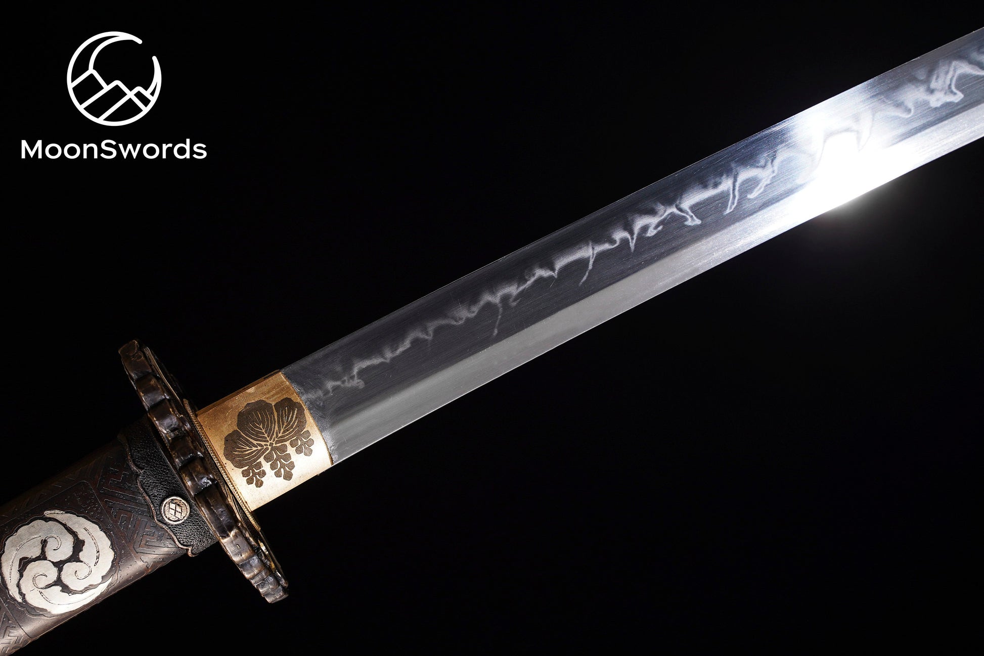 a sword with a gold and silver decoration on it