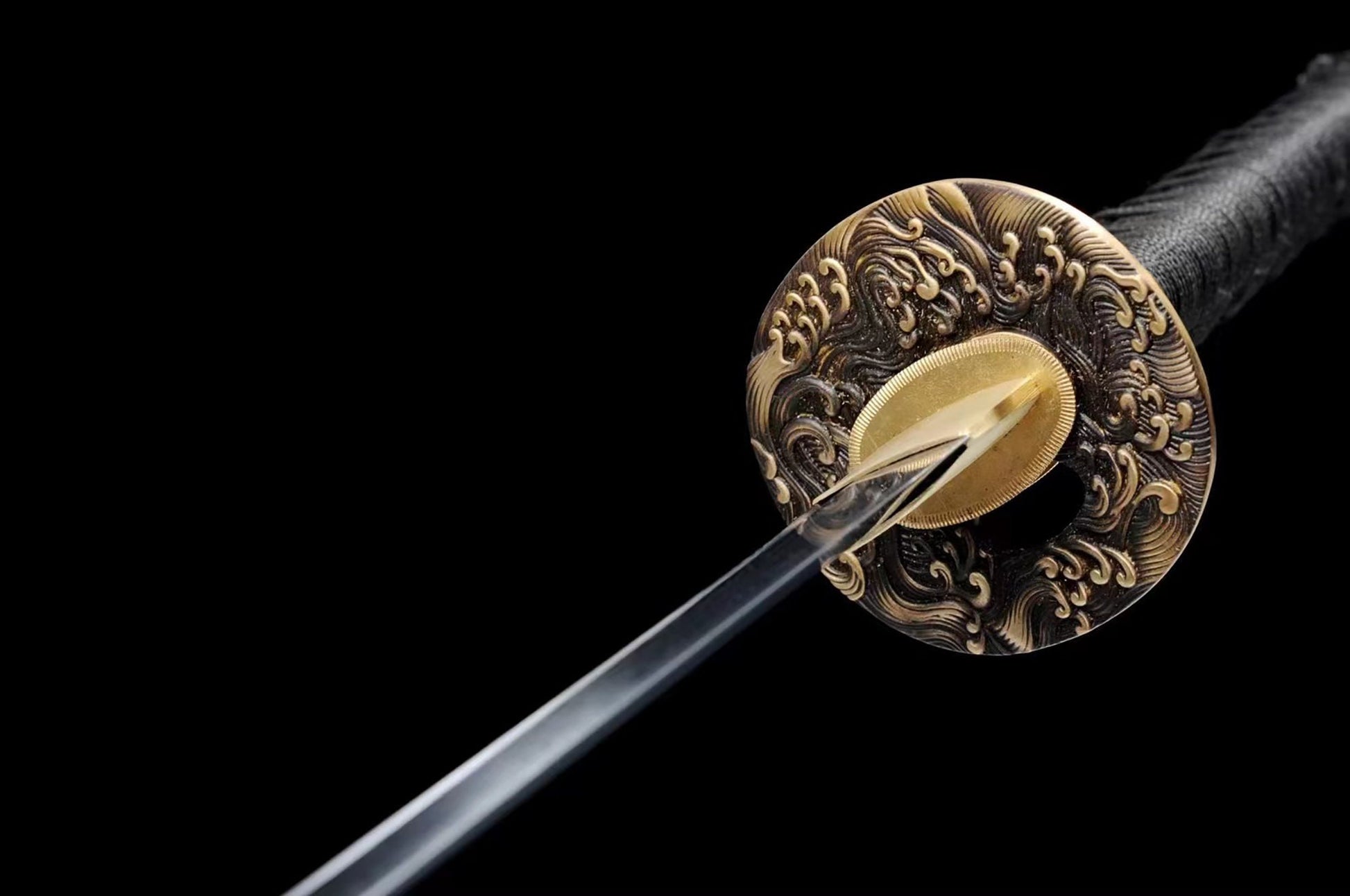 a close up of a sword on a black background