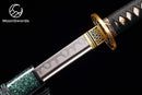 a close up of a knife on a black background