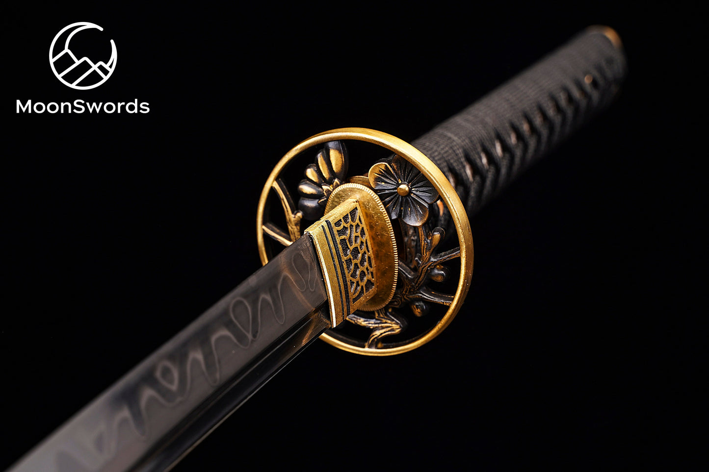 a close up of a gold and black sword