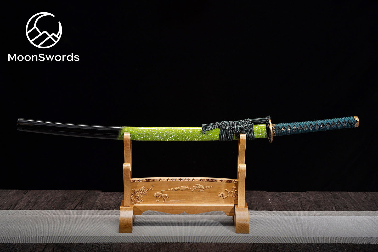 a wooden stand with a green and black sword on it