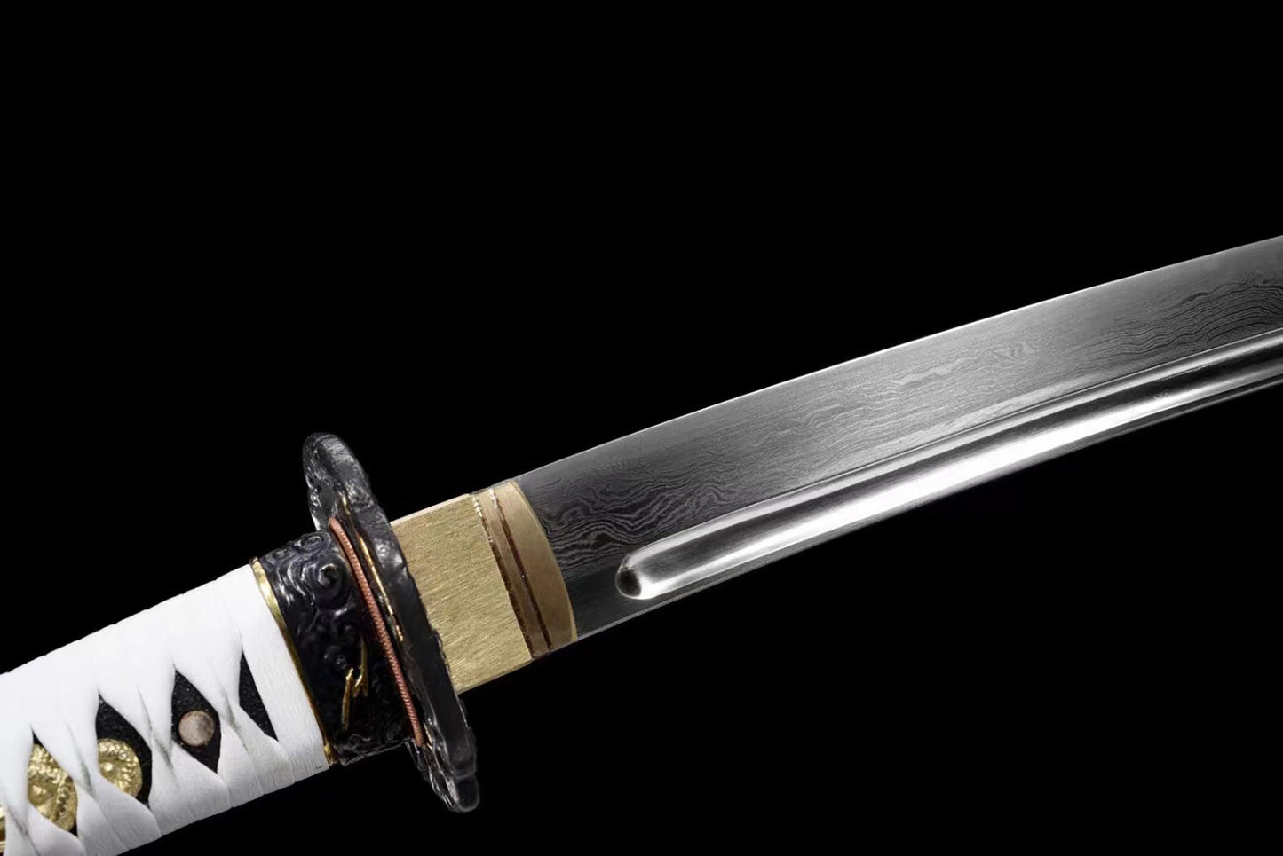 a very nice looking knife with some sort of decoration on it