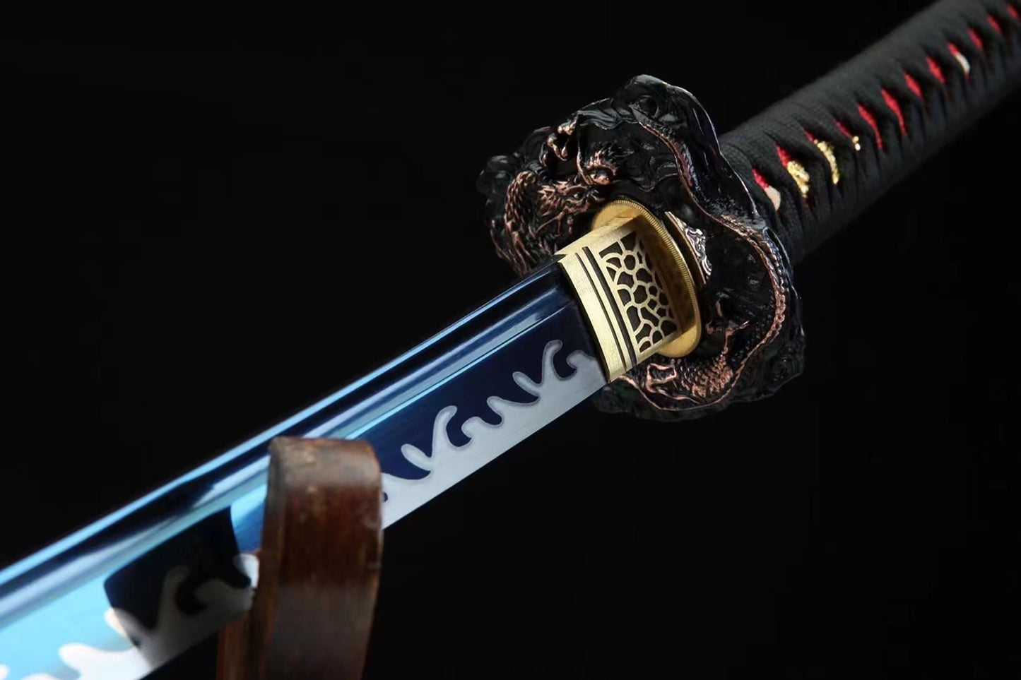 a close up of a sword on a black background