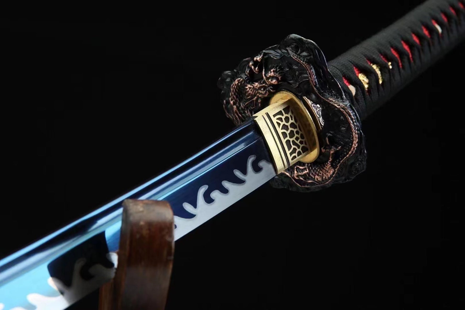 a close up of a sword on a black background