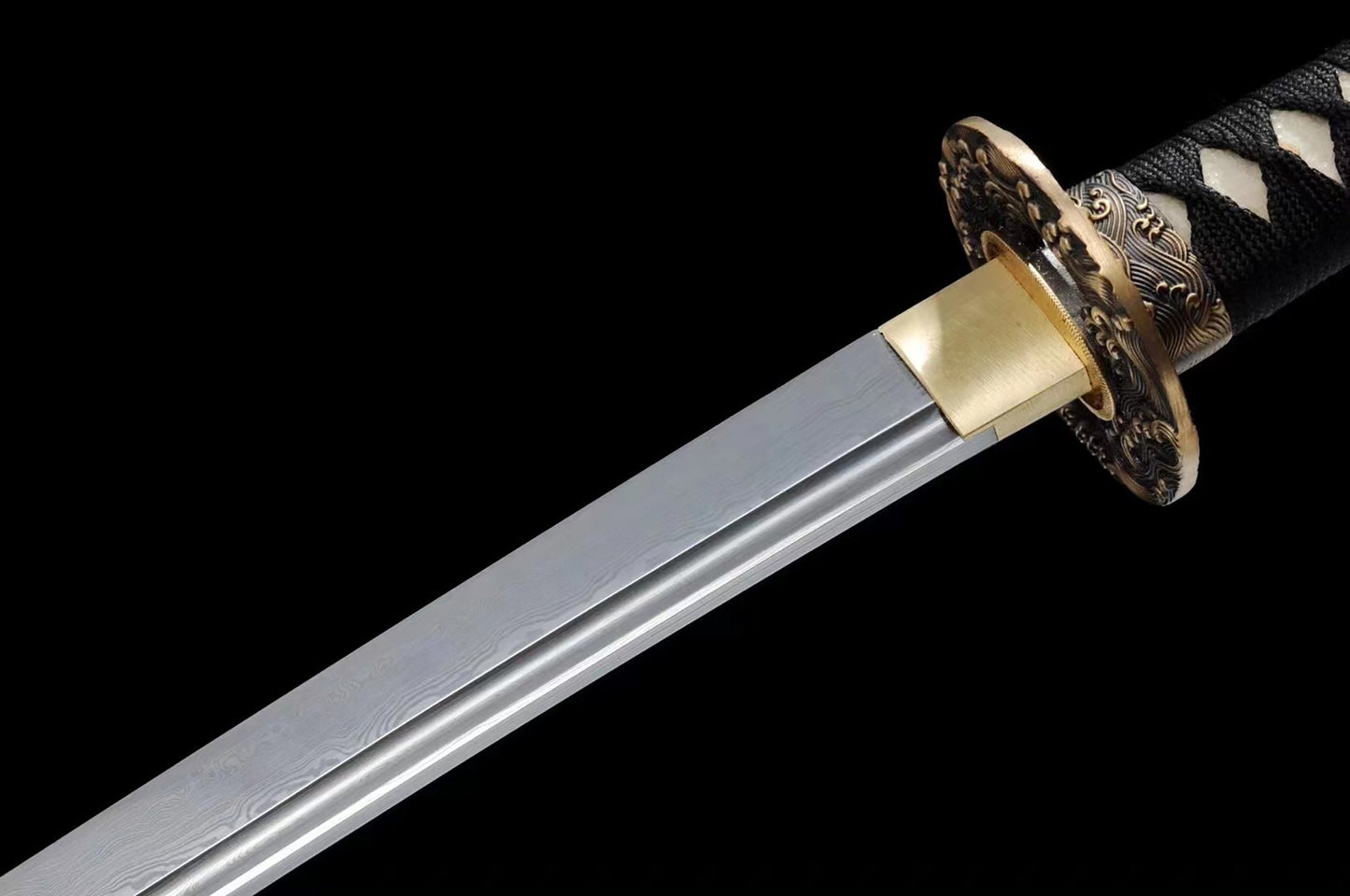 a sword with a black and white pattern on it