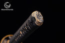 a close up of a metal object on a black background