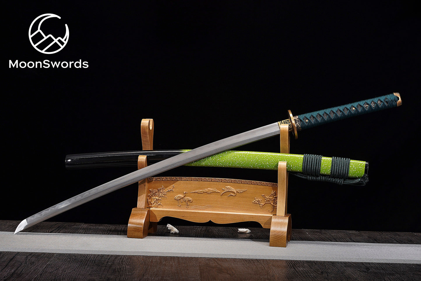 a wooden stand with two swords on top of it