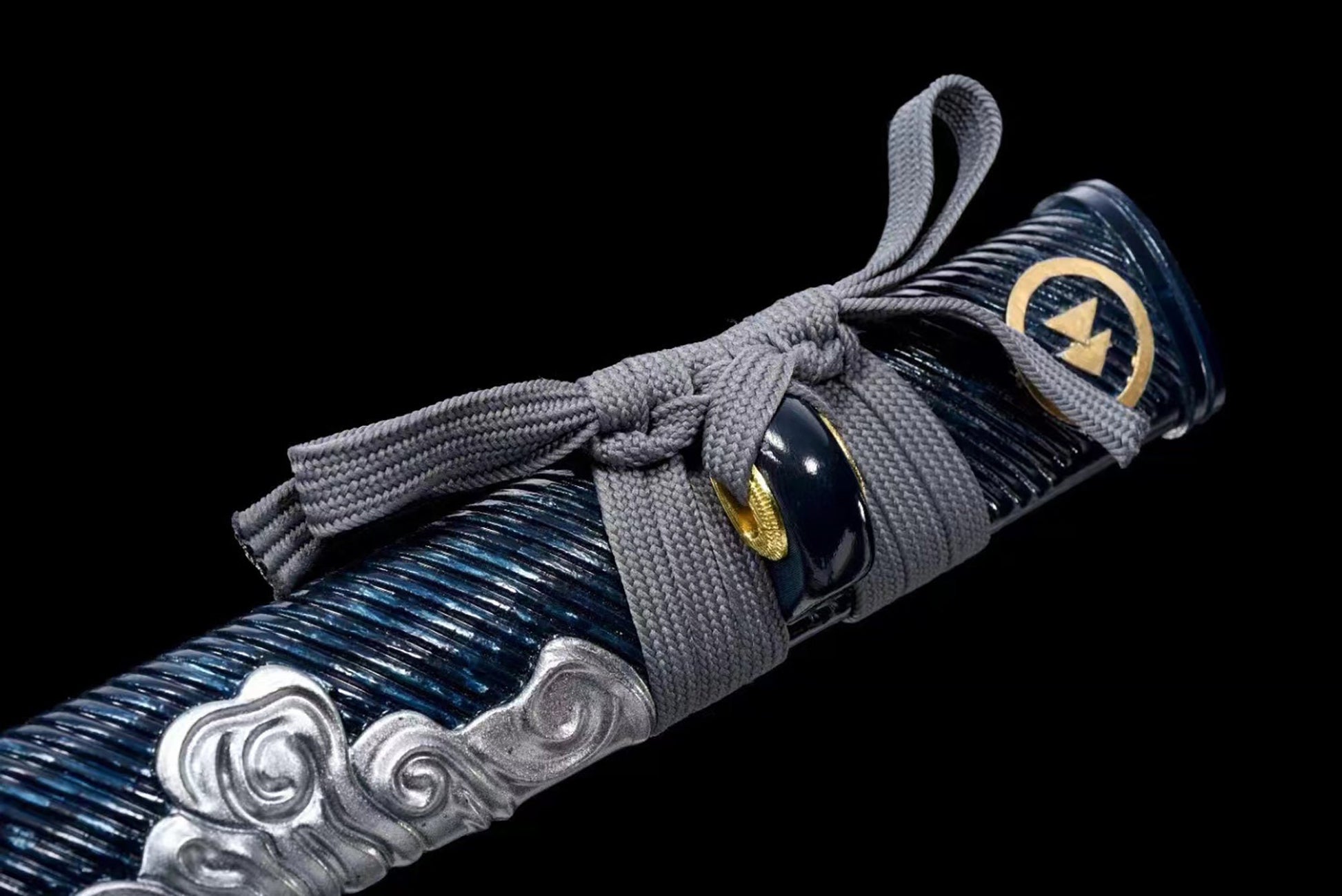 a close up of a decorative object on a black background