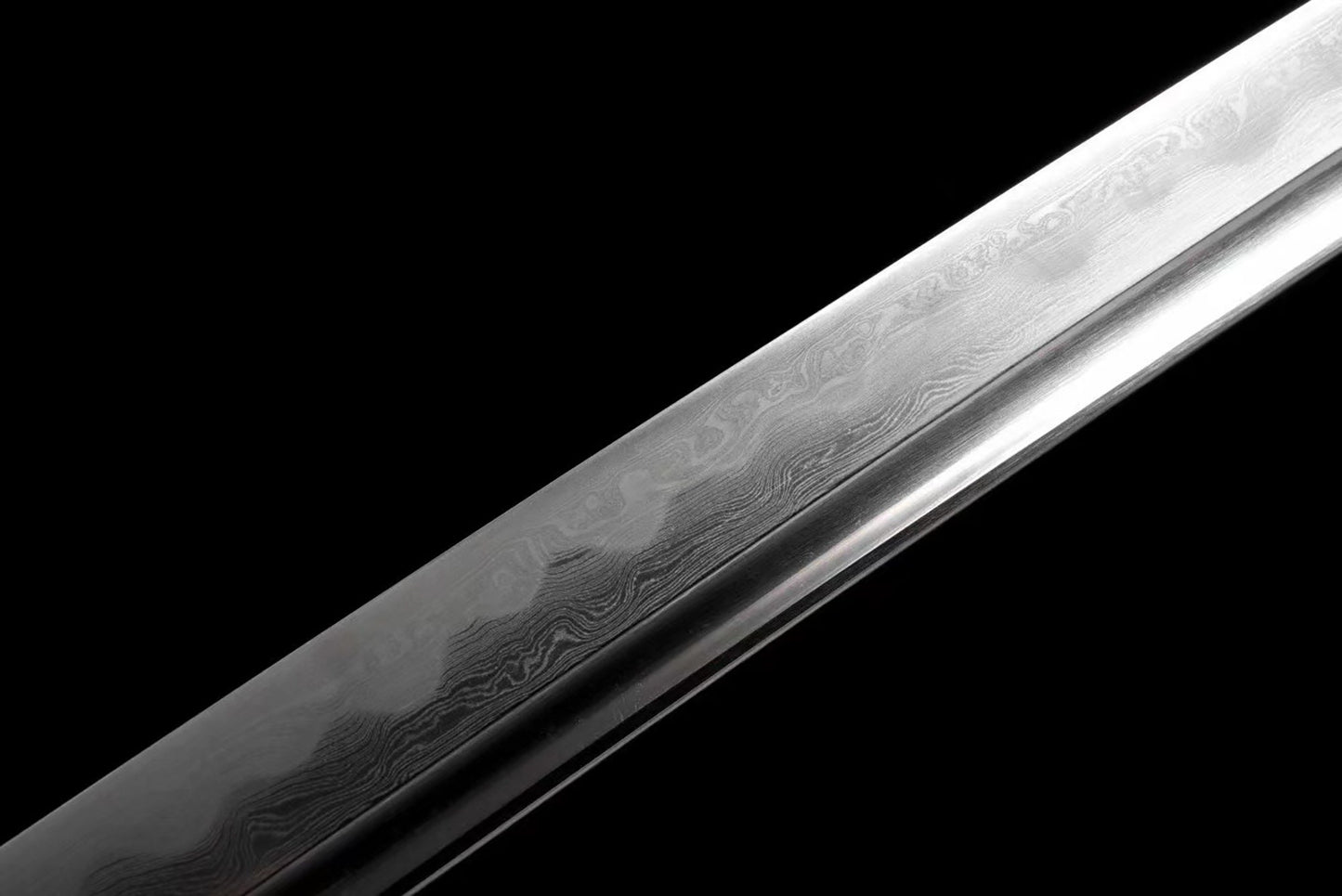 a knife that is on a black surface