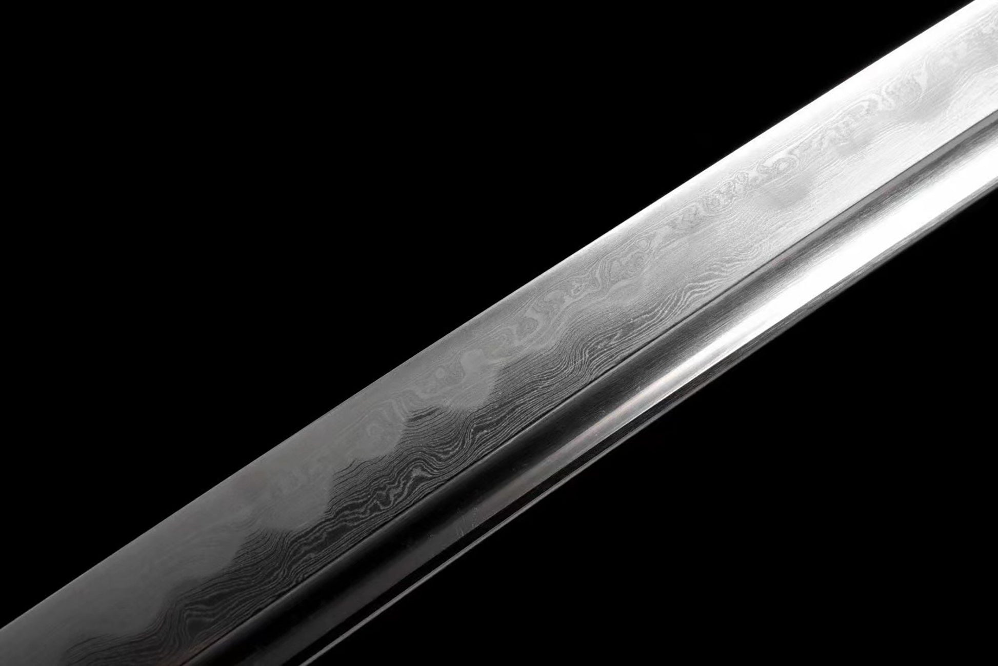 a knife that is on a black surface